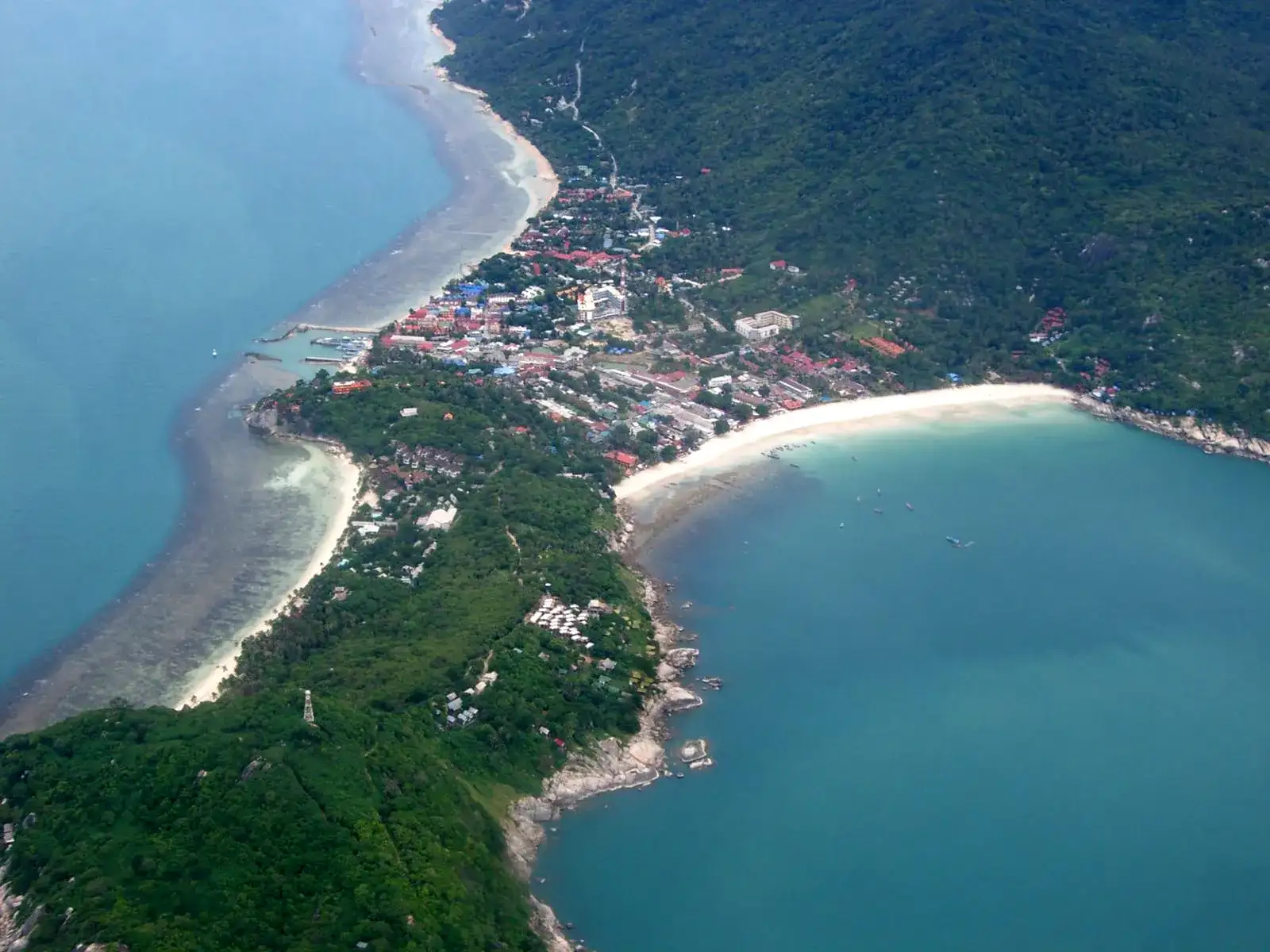 Aerial view of the Haad Rin peninsula and its two bays on Koh Phangan